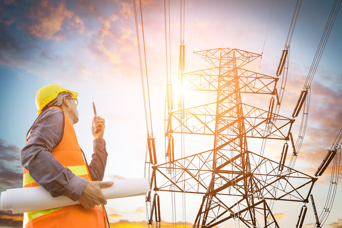 electric engineer inspect the high voltage pole